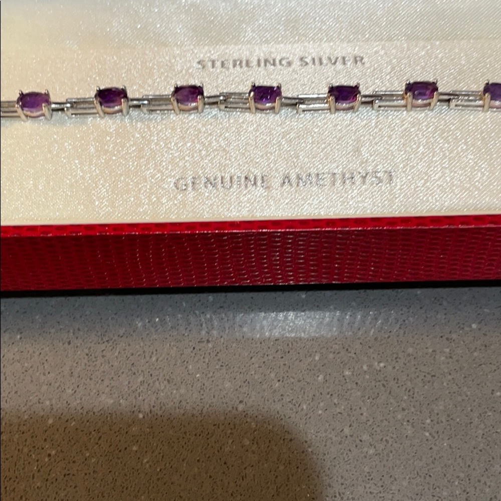 Never worn beautiful amethyst and sterling silver